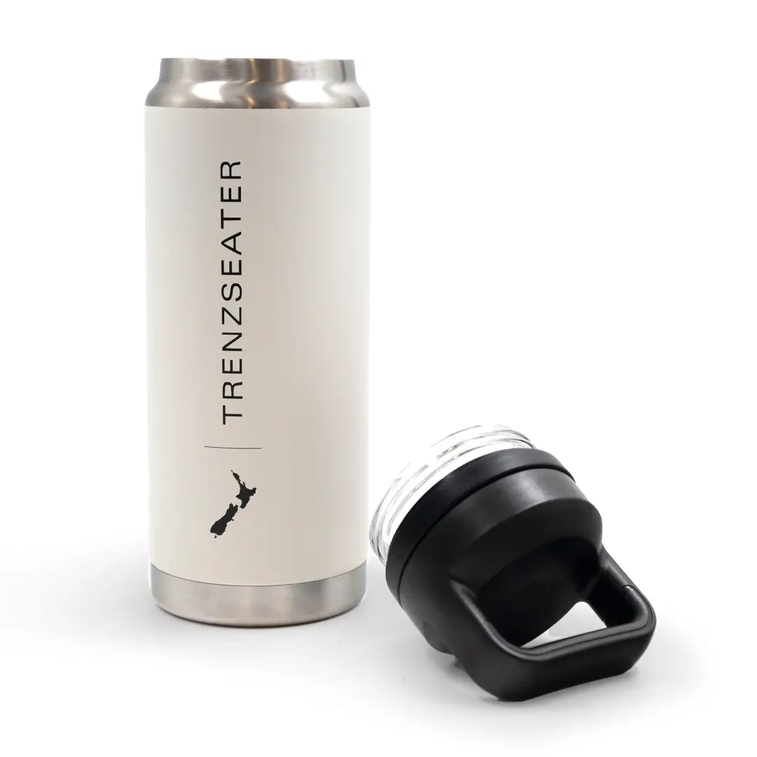 Insulated tumbler with open black lid on white background