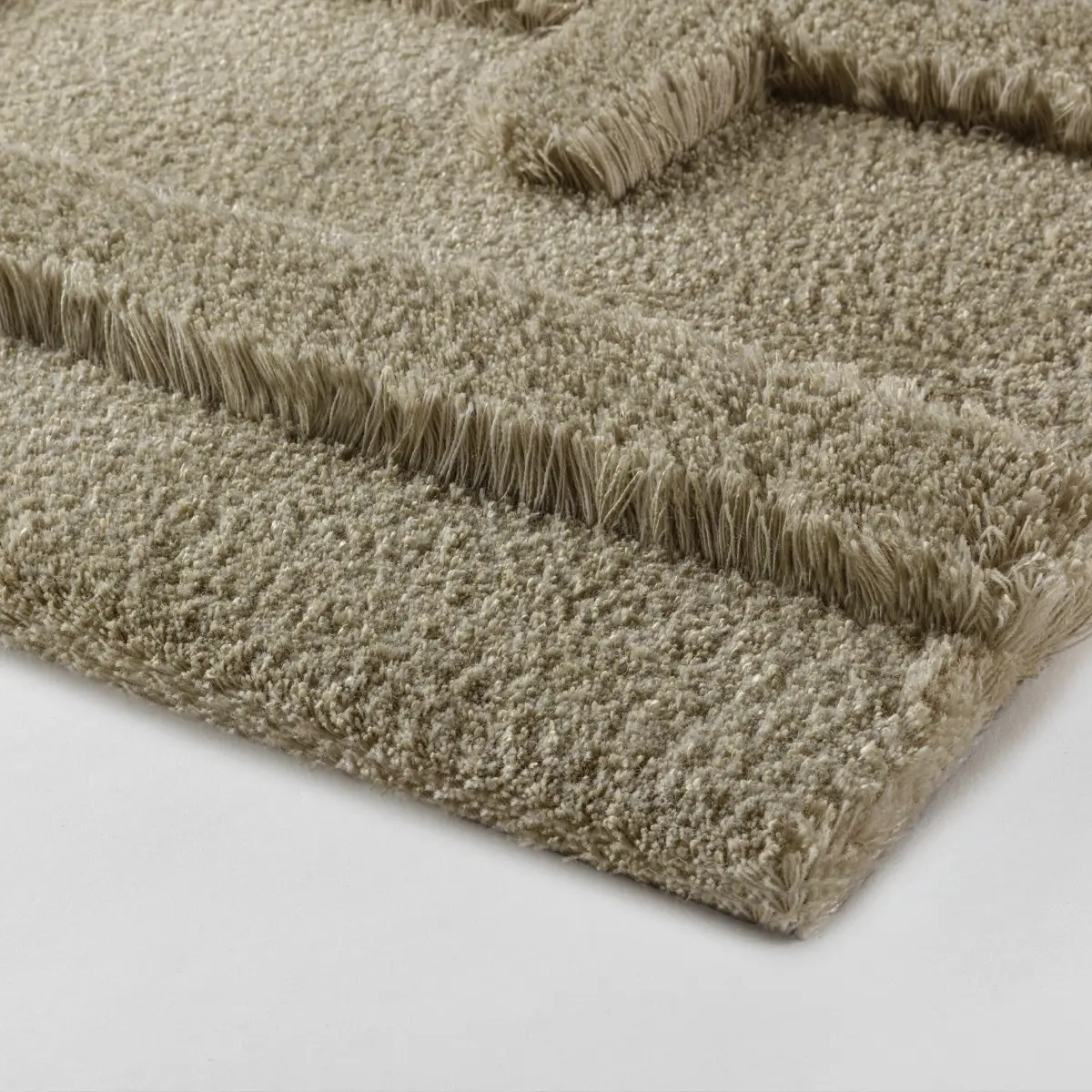 Close-up of beige textured carpet sample