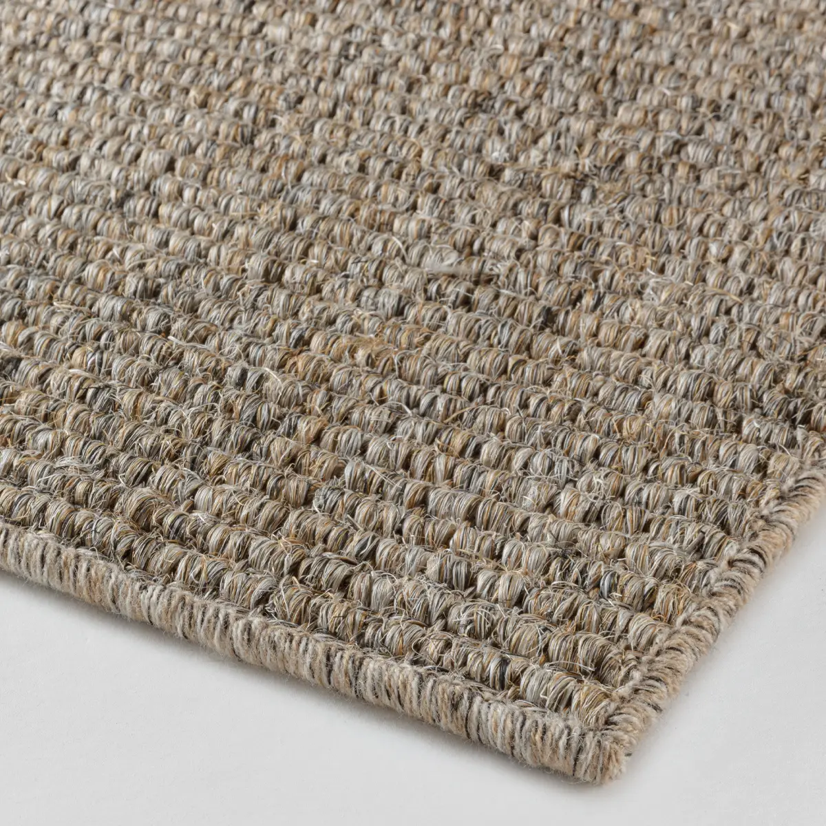 Close-up view of woven sisal area rug texture