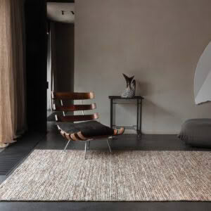 Modern minimalist interior with stylish rocking chair and decor
