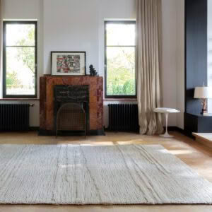 Elegant room with marble fireplace and large windows