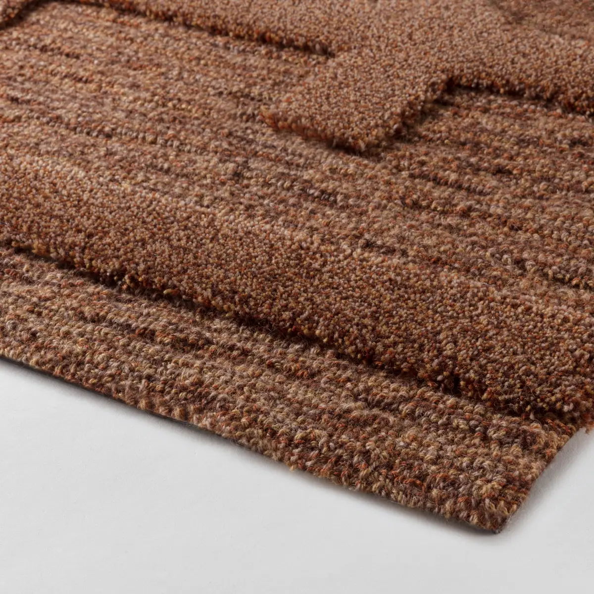 Close-up of textured brown carpet