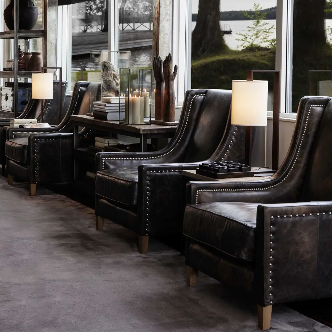 AW44-armchair_2 Elegant office with leather chairs and stylish decor.