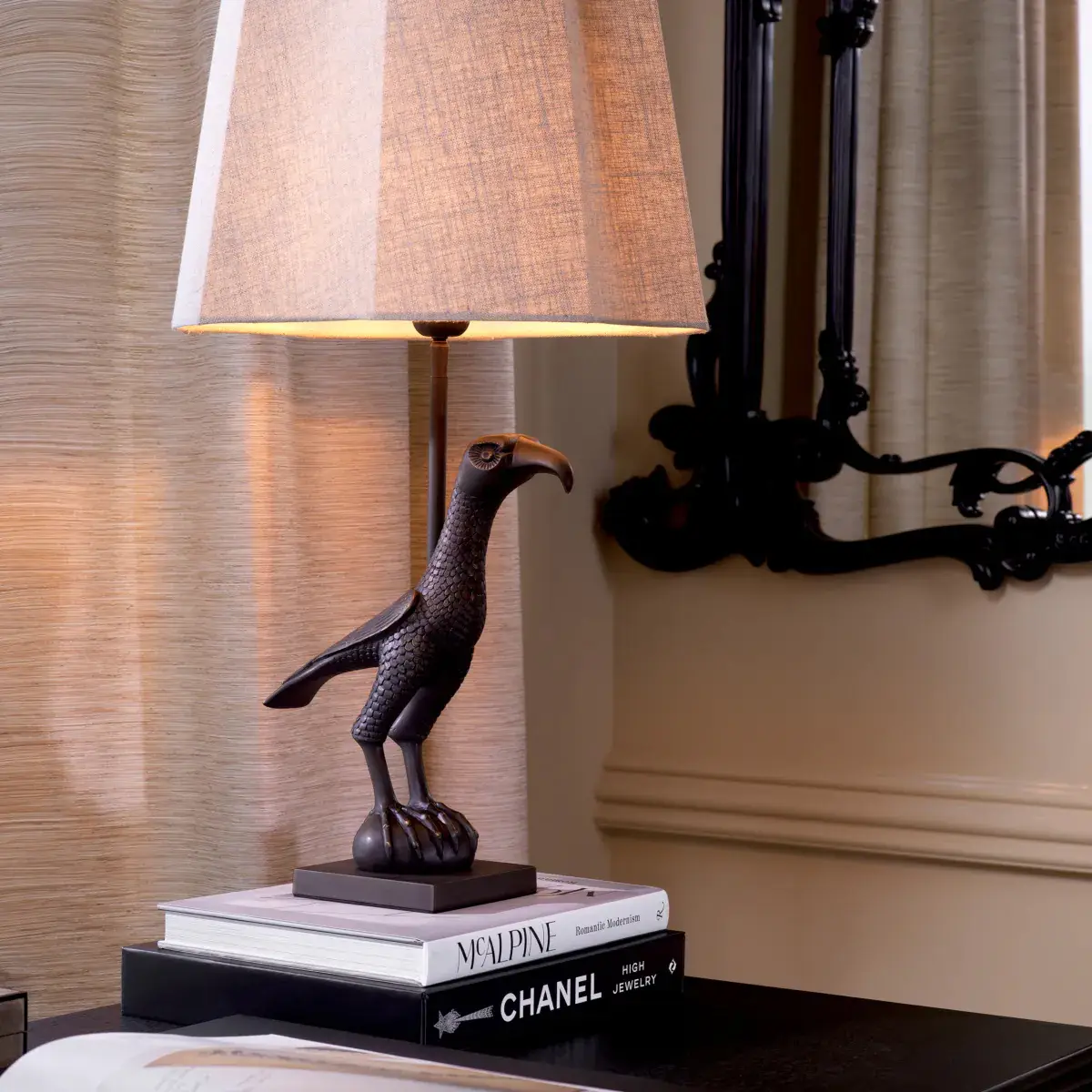 Eagle statue table lamp on stack of books