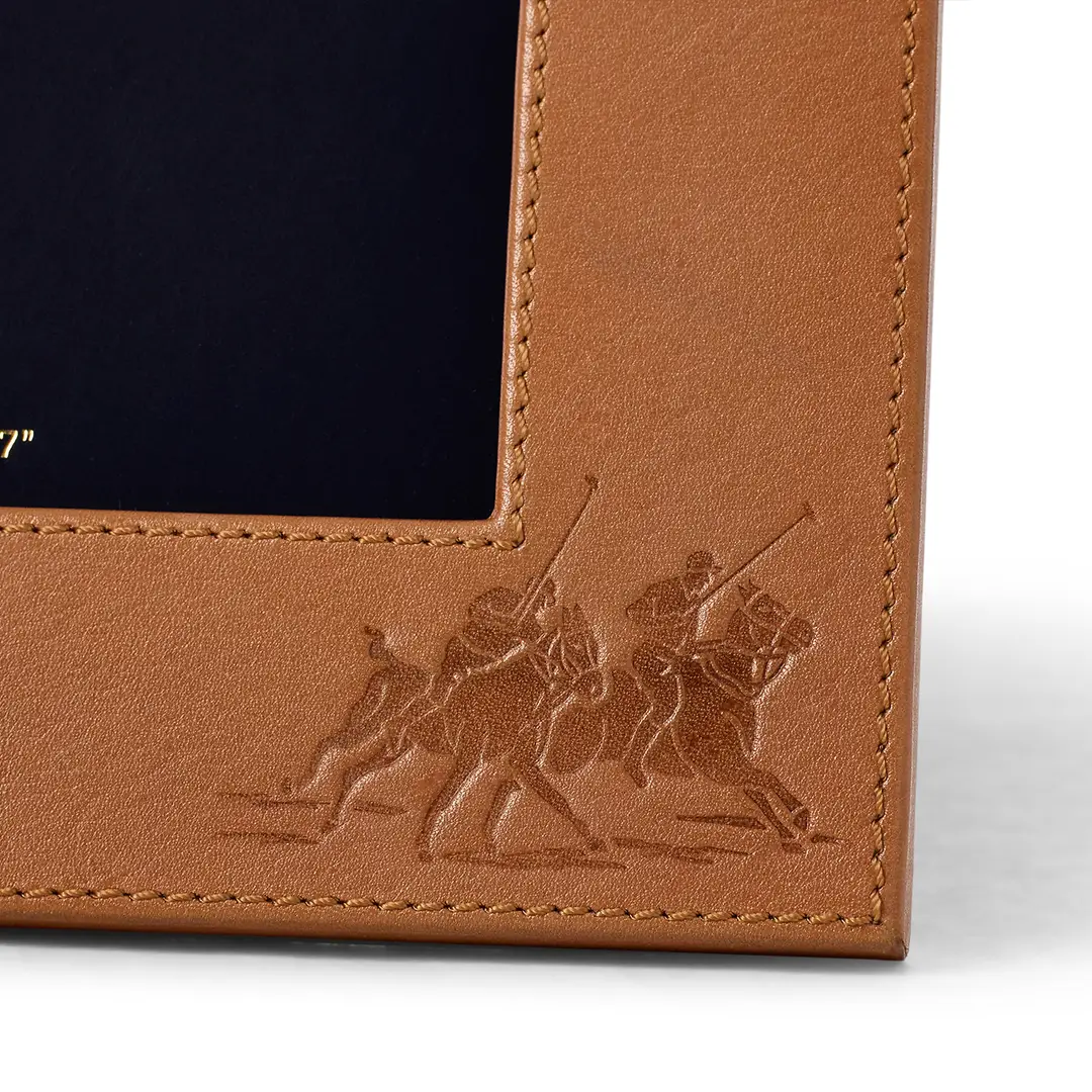 Embossed polo players on brown leather wallet