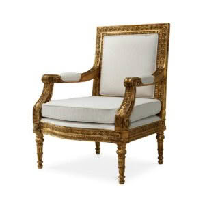 Ornate gold-trimmed vintage armchair with white cushions