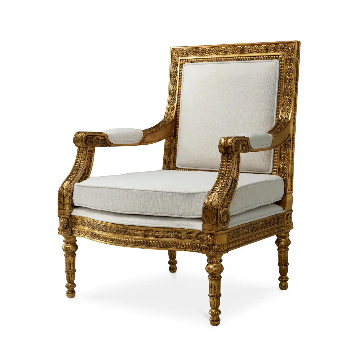 Ornate gold-trimmed vintage armchair with white cushions