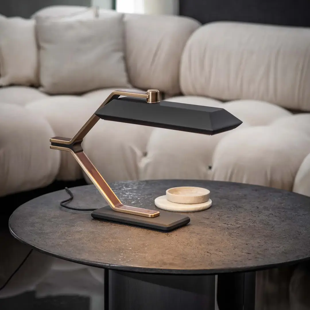 Modern desk lamp on a round table in cozy room