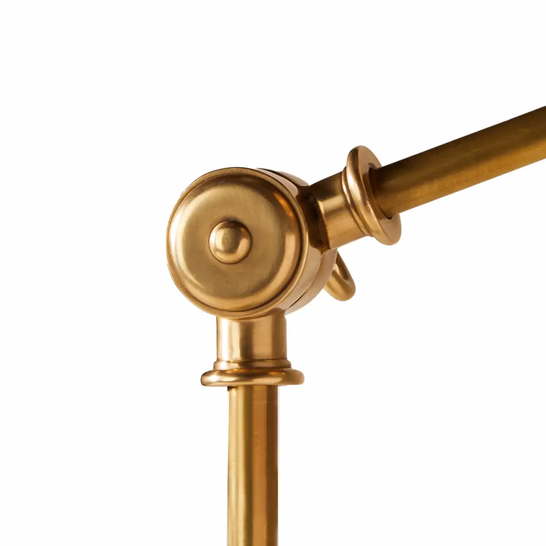 Golden brass curtain rod end close-up