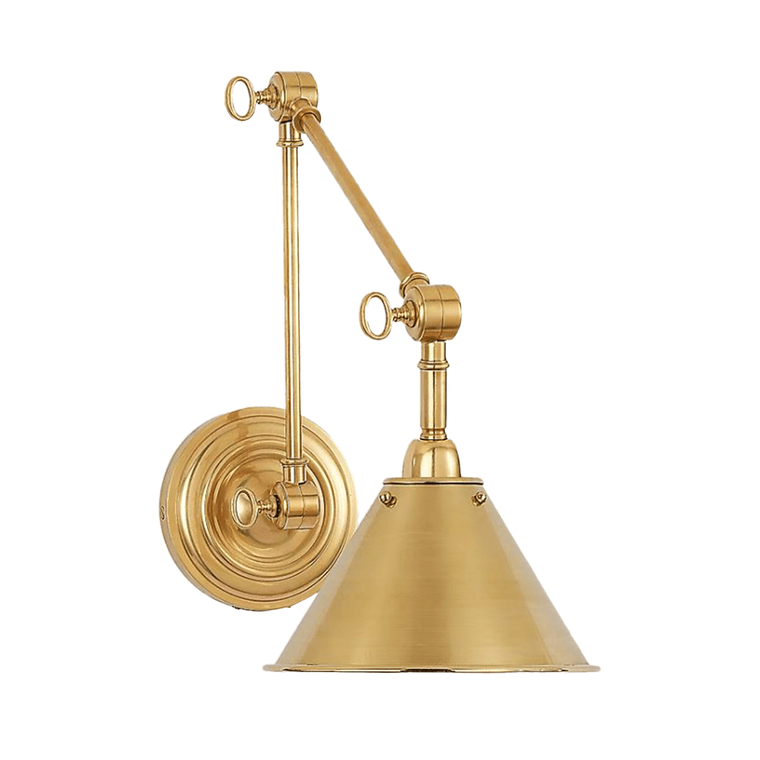 Gold wall-mounted adjustable sconce light.