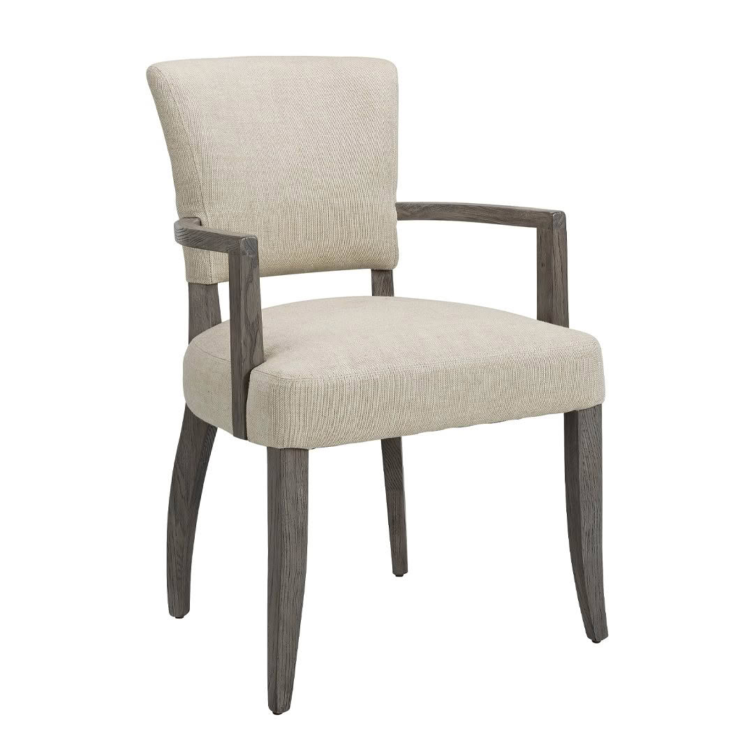 Beige upholstered chair with dark wooden arms and legs.