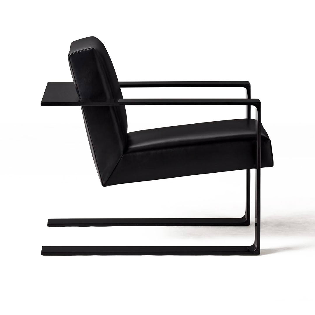Modern black leather chair with metal frame