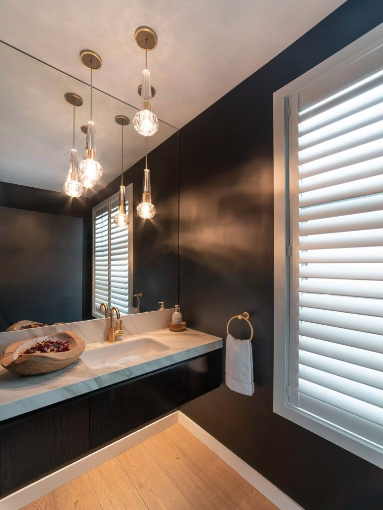 Elegant bathroom interior with modern lighting and dark walls