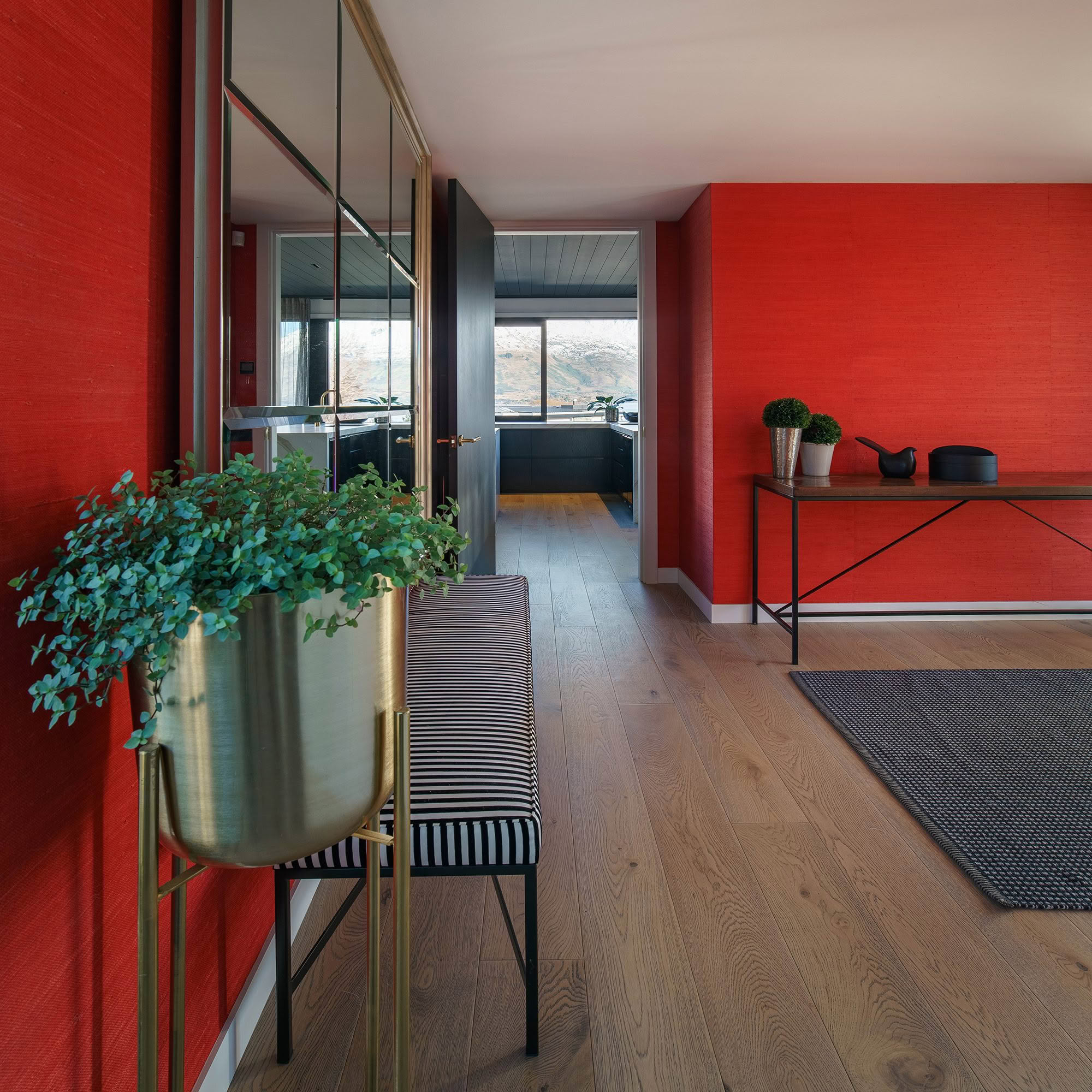 Modern interior, red walls, stylish hallway with plant decor