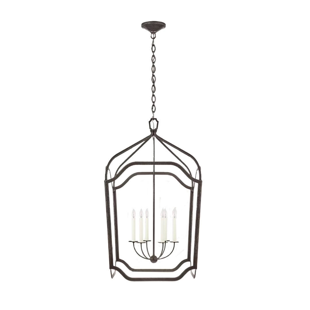Elegant iron lantern-style chandelier with five candle lights.