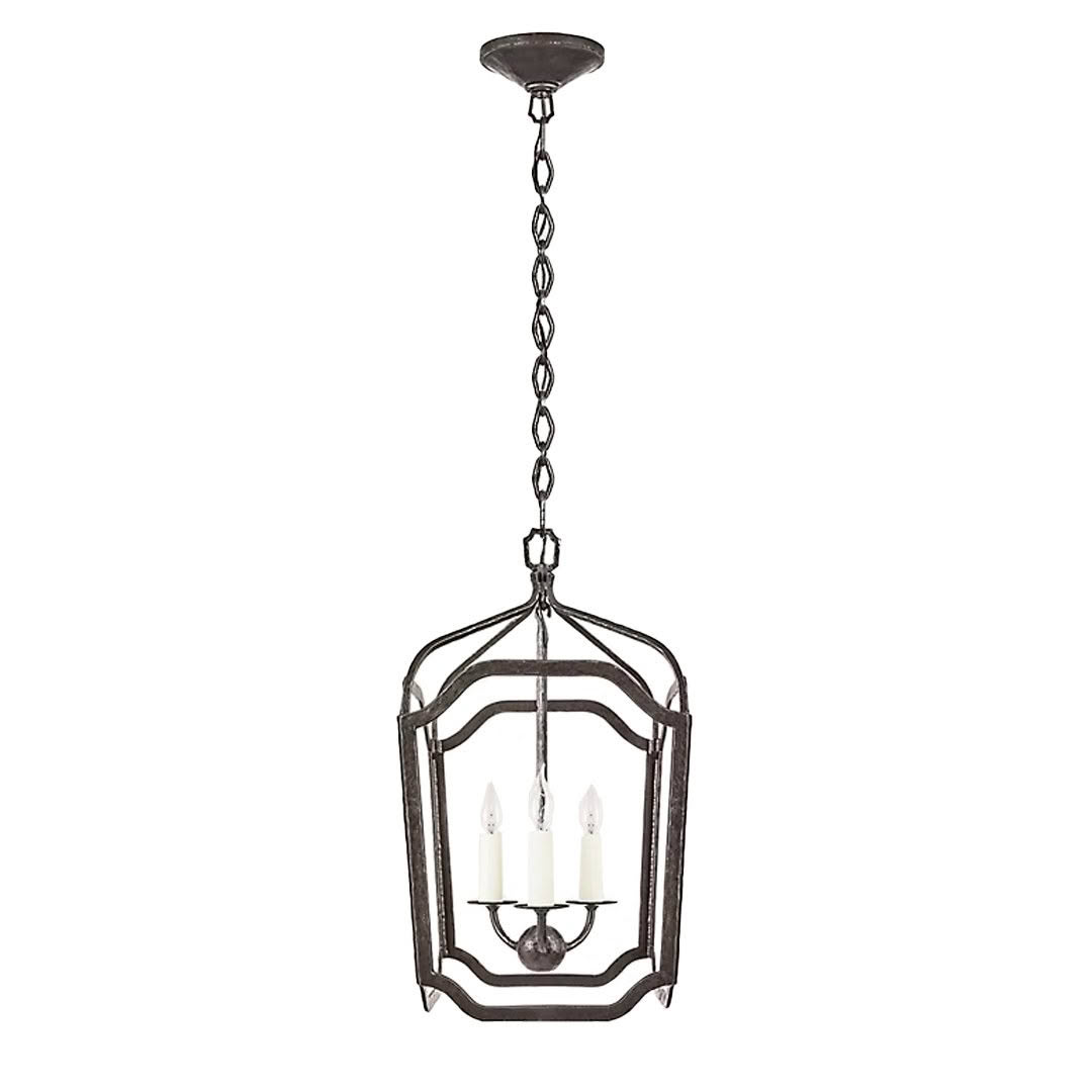 Antique-style metal lantern chandelier with candles