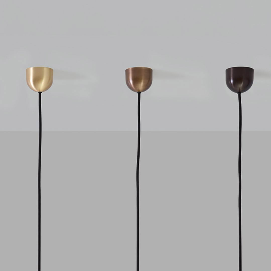 Three modern lamps in gold, copper, and bronze colors