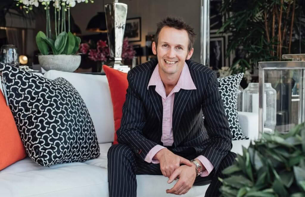 Man smiling on couch in elegant living room