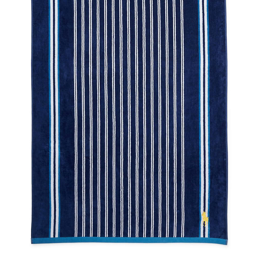 Blue towel with white vertical stripes and logo