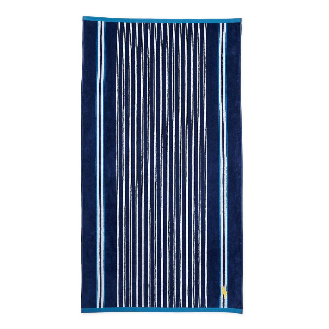 Navy blue beach towel with white vertical stripes