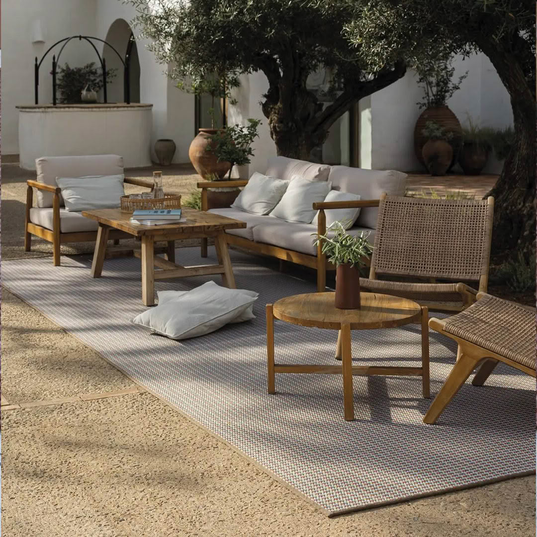 Outdoor patio with wooden furniture and Mediterranean decor