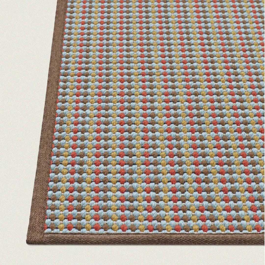 Close-up of textured multicolored woven rug