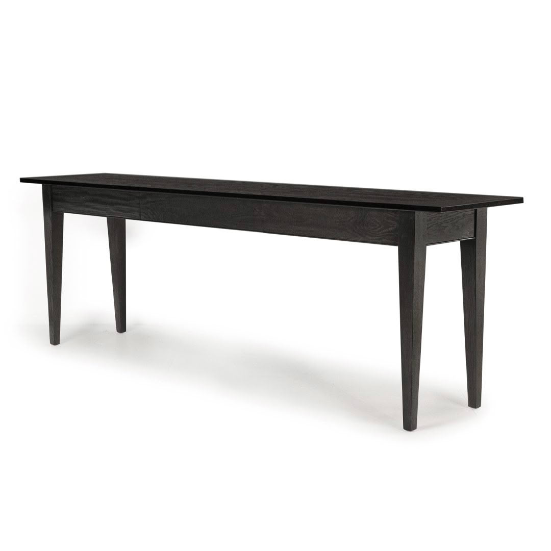 Minimalist long black wooden dining table.