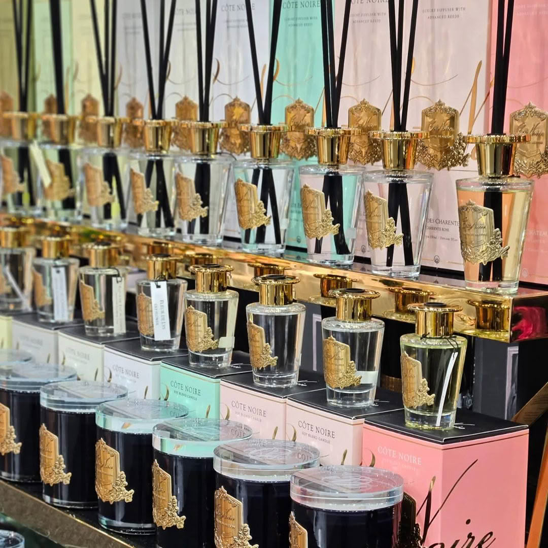 Elegant perfume bottles with decorative gold tops on display