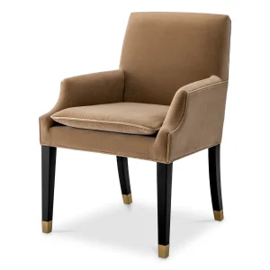 Elegant tan upholstered chair with black legs