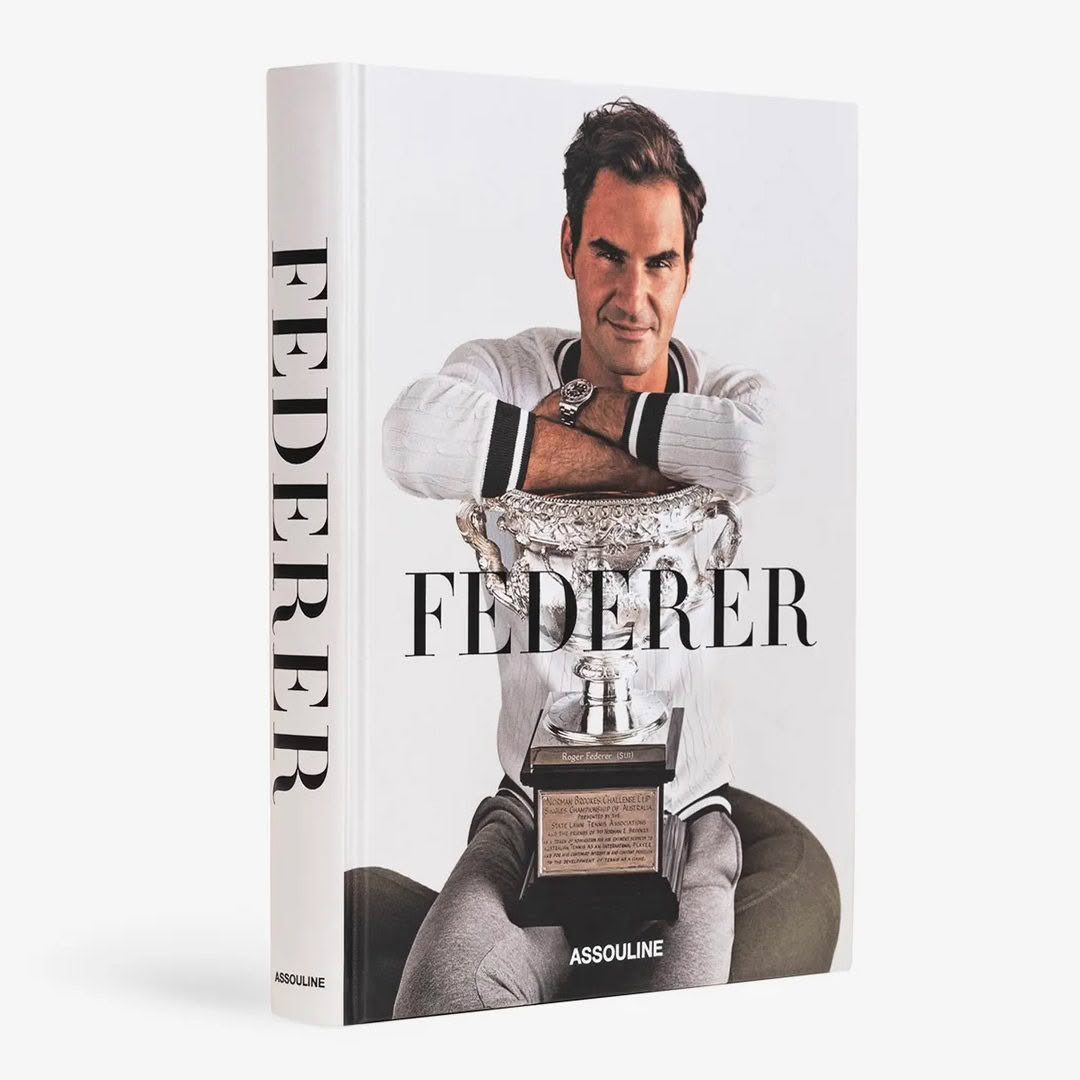 Book cover featuring Roger Federer holding a trophy