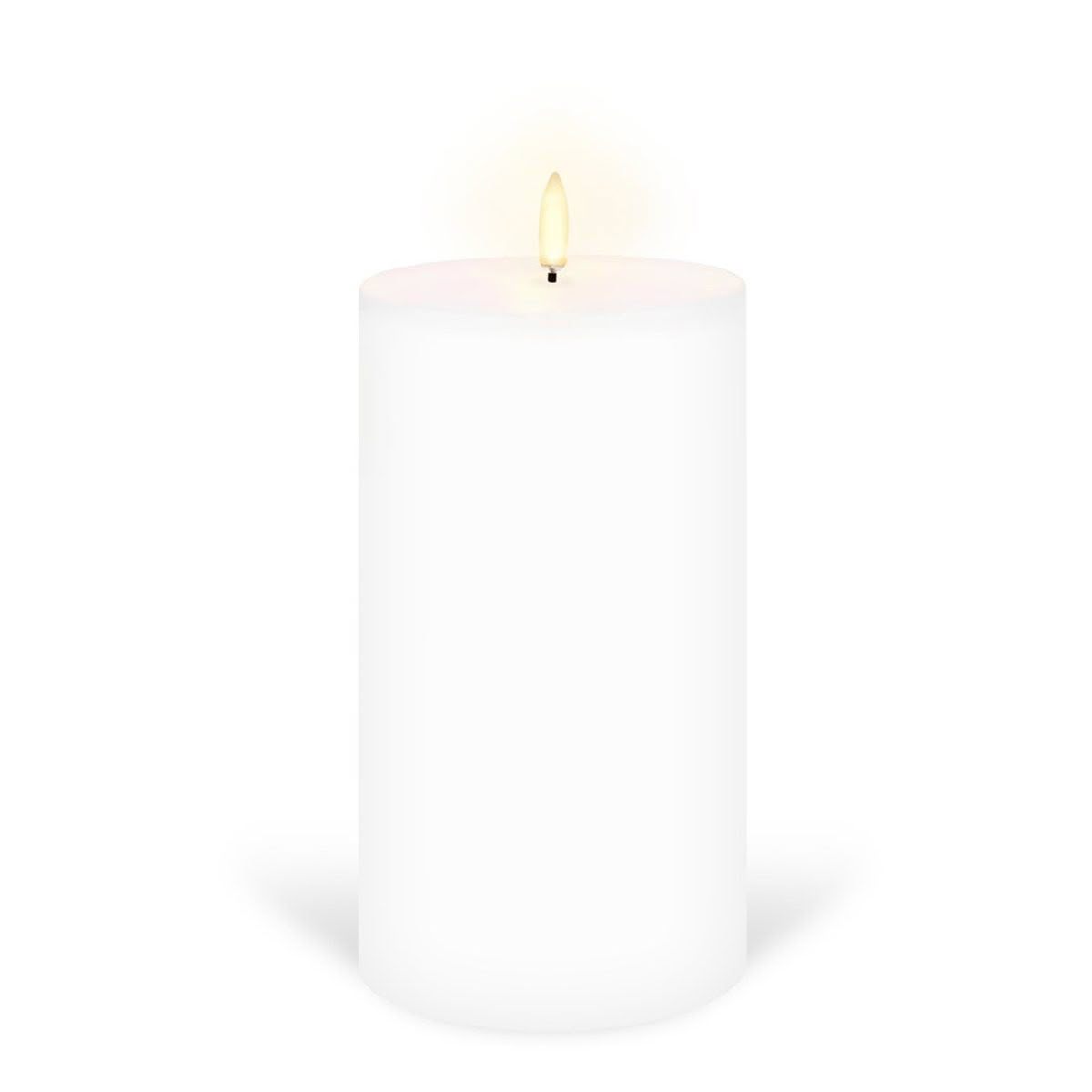 Single lit white candle on plain background