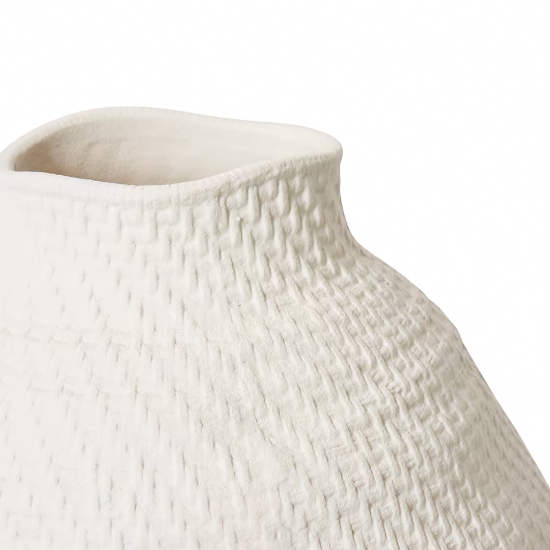 Close-up of white textured ceramic vase neck