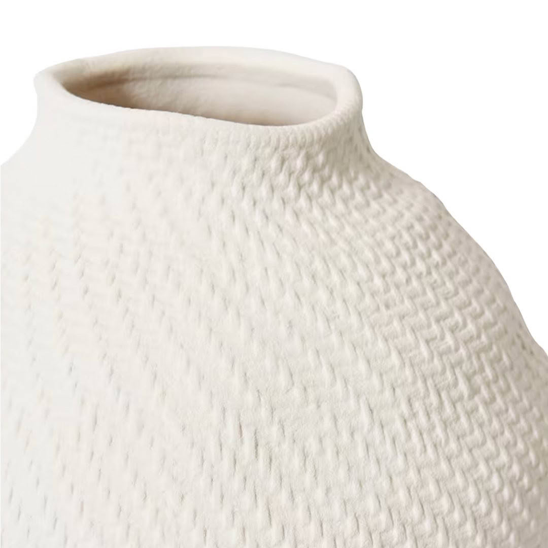 Close-up of textured white ceramic vase