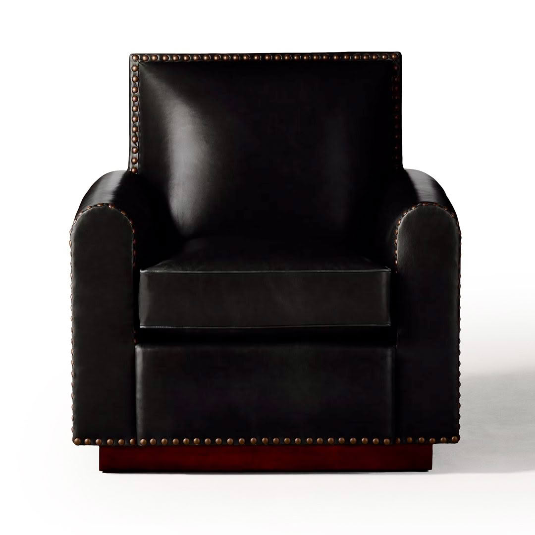Elegant black leather armchair with brass nailhead trim