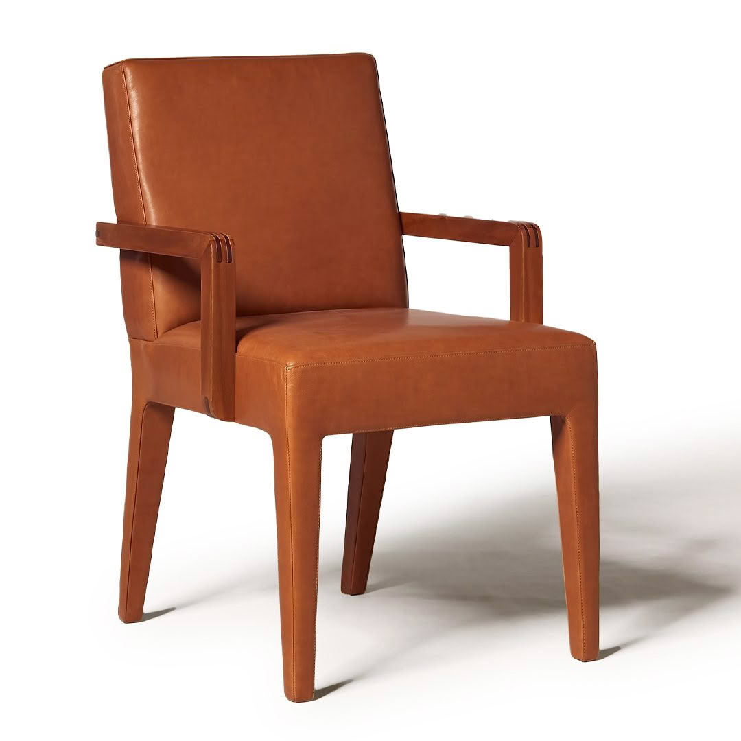 Brown leather armchair on white background