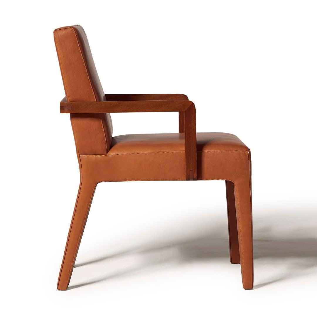 Modern brown leather armchair on white background