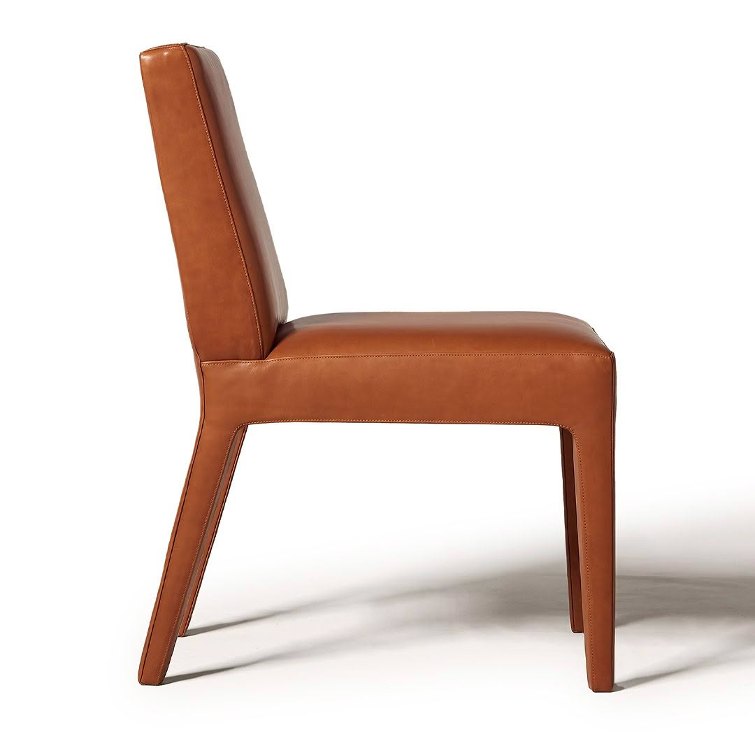 Modern brown leather dining chair isolated on white