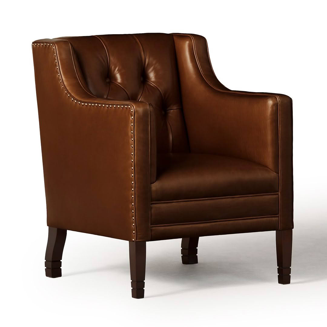 Elegant brown leather armchair with nailhead accents