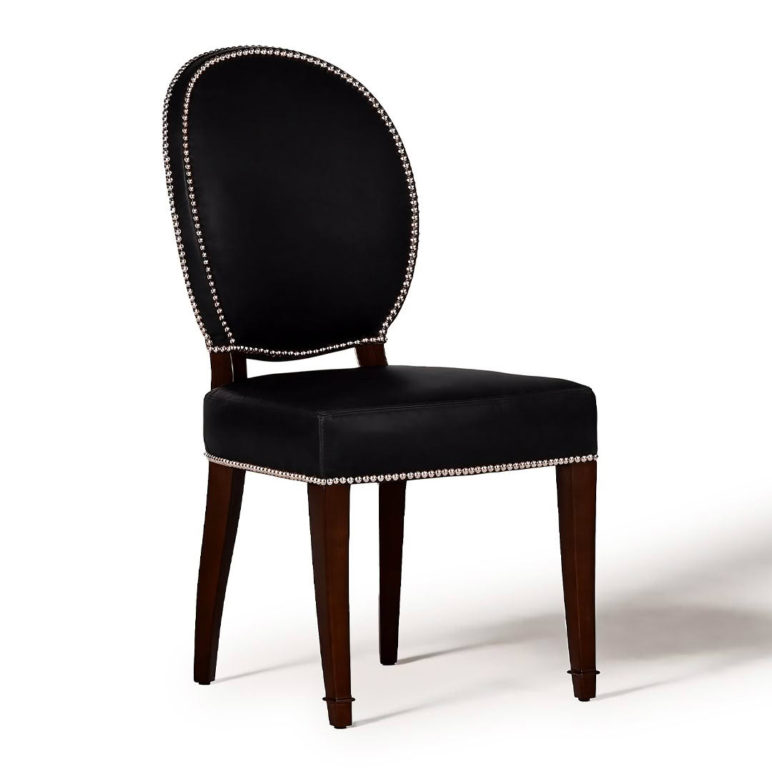 Elegant black upholstered chair with nailhead trim