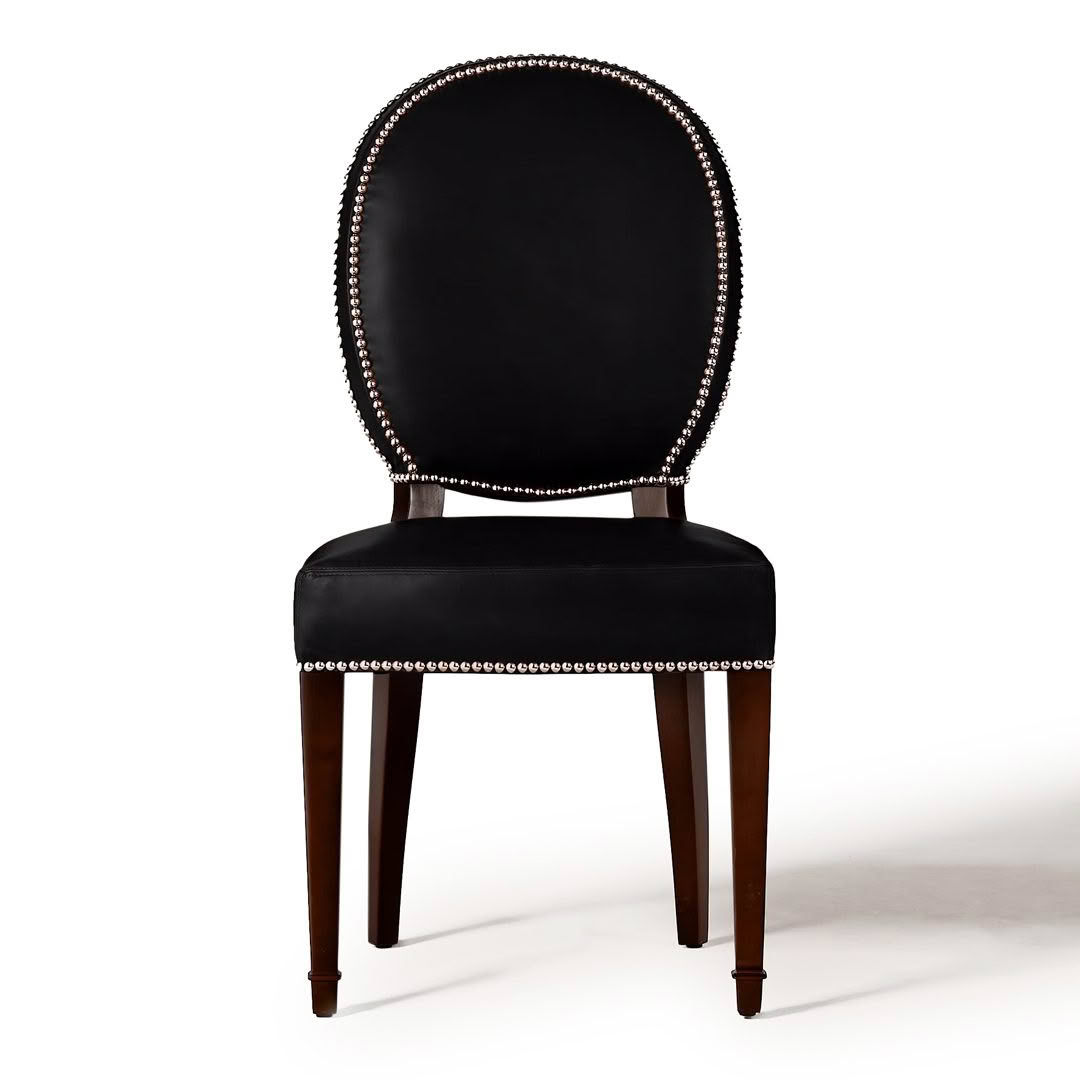 Elegant black upholstered chair with nailhead trim