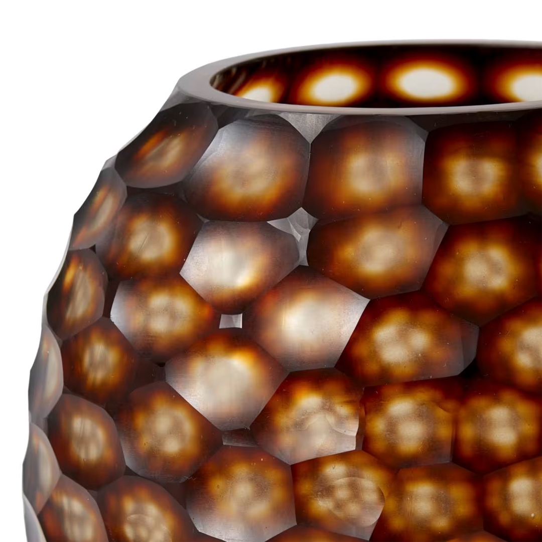Close-up of a textured glass vase with honeycomb design
