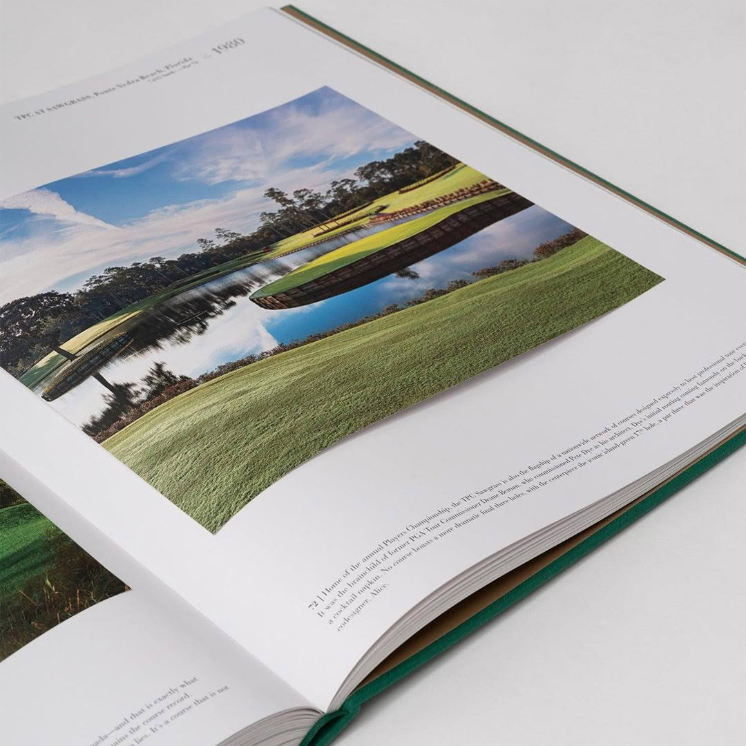 Golf-The-Impossible-Collection Open book featuring scenic landscape photograph on page