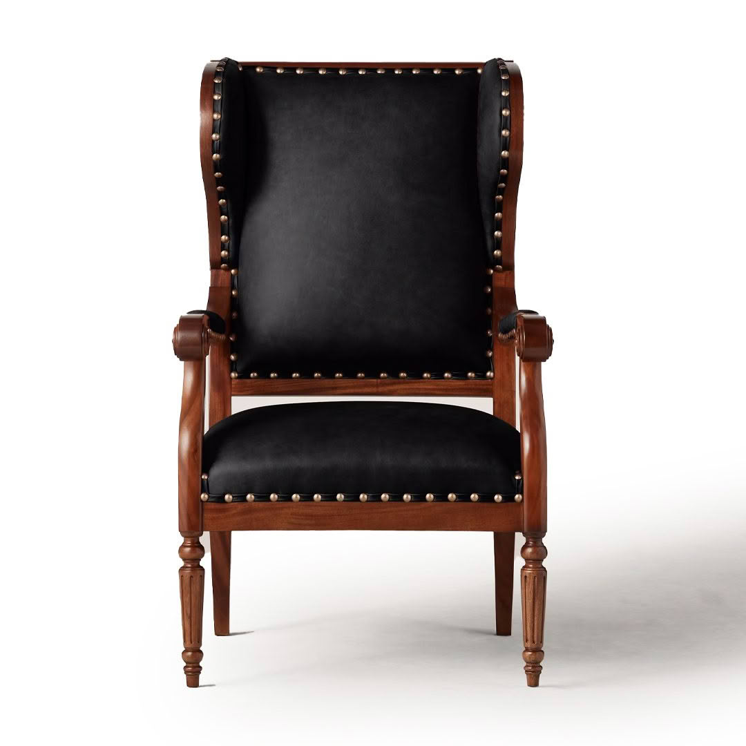 Antique wooden chair with black leather upholstery