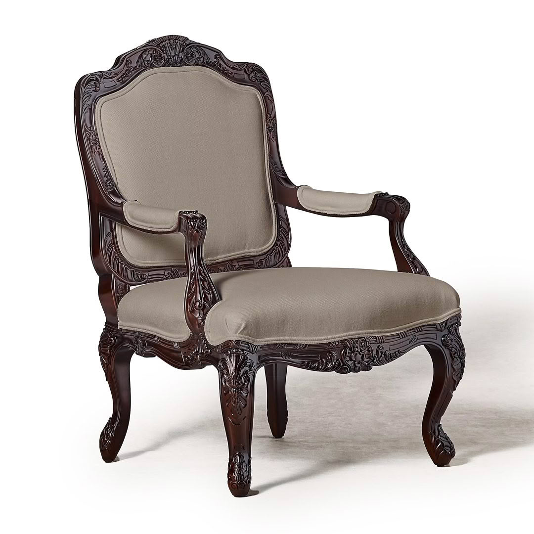 Elegant antique carved wood chair with beige upholstery