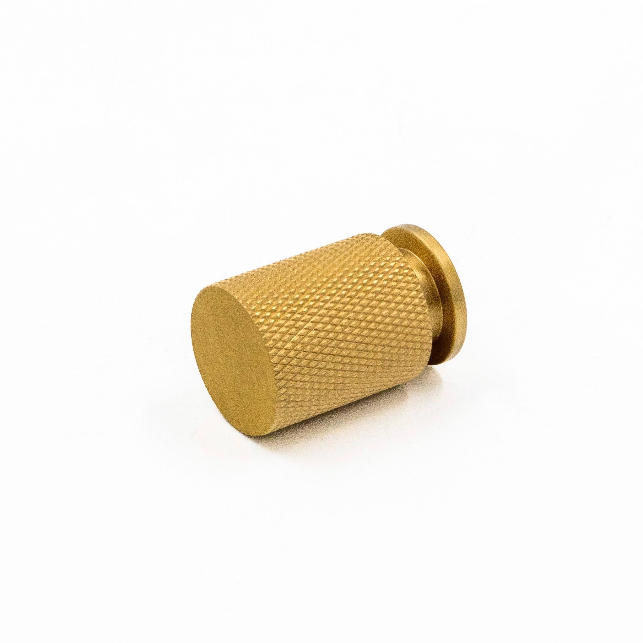 Gold textured knob on white background
