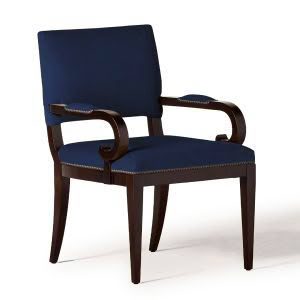 Elegant blue upholstered chair with dark wooden arms