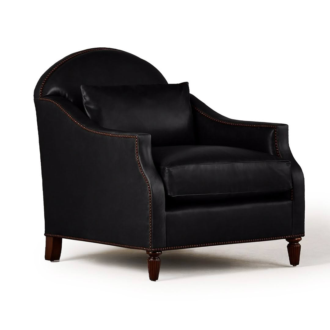 Elegant black leather armchair with wooden legs