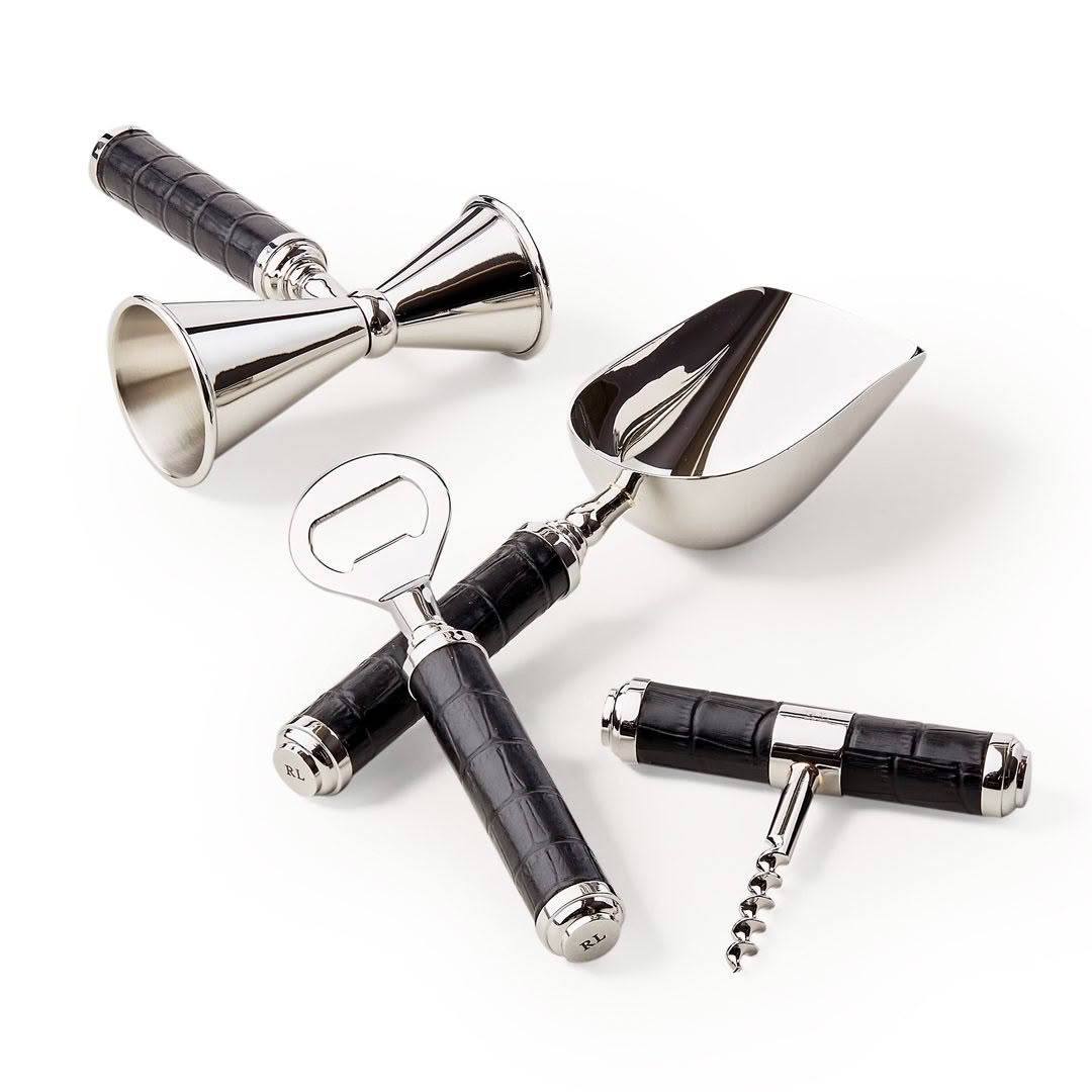 Elegant barware tools with black handles on white background
