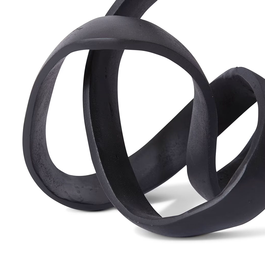 Black intertwined rubber loops on white background