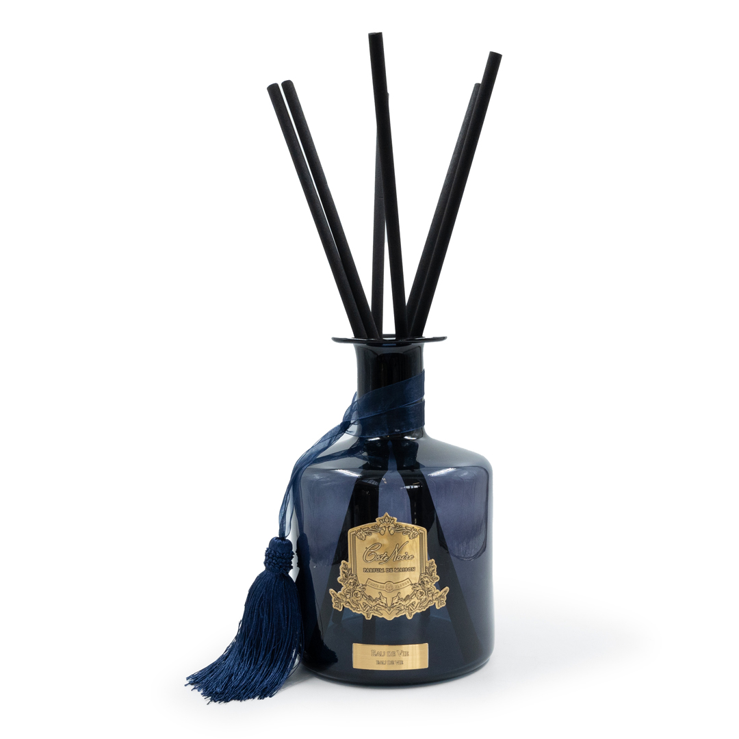 Blue reed diffuser bottle with black sticks